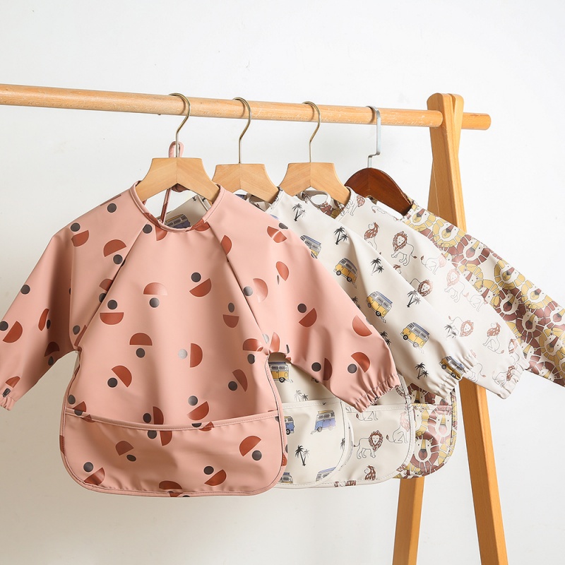 Long-sleeved PU reversible bib - Bib Long Sleeve recension och pris