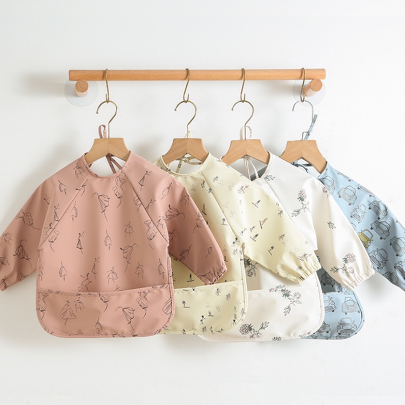 Long-sleeved PU reversible bib - Bib Long Sleeve recension och pris